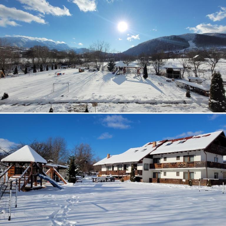 Panoramă de iarnă cu pensiunea și munții din jur